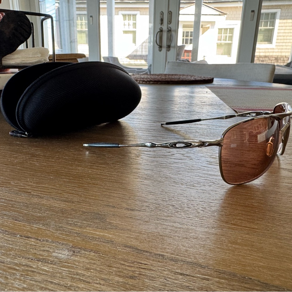 Oakley Sunglasses with Copper Lenses and Silver Frame